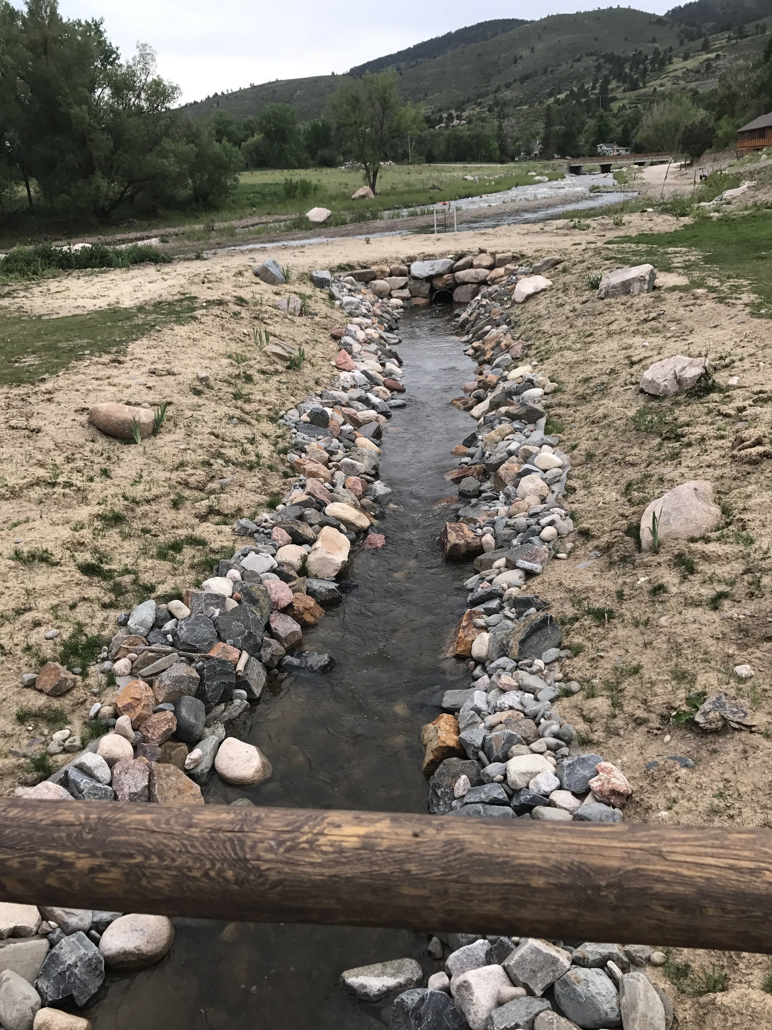 Sylvan Dale Ranch - Man made river bed designed by Titus, with each rock being hand-placed by the crew in order to create a natural looking design.