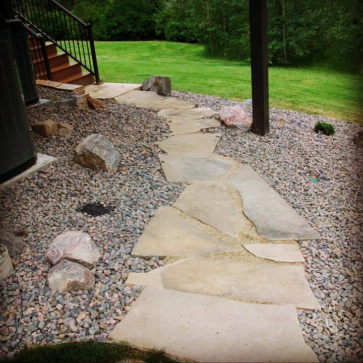 Flagstone pathway set in tan Breeze.