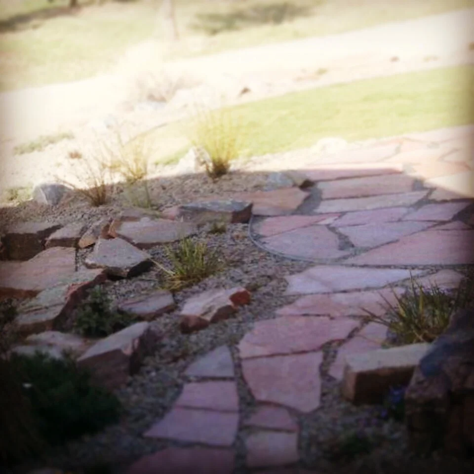 Creative view of a flagstone pathway install.
