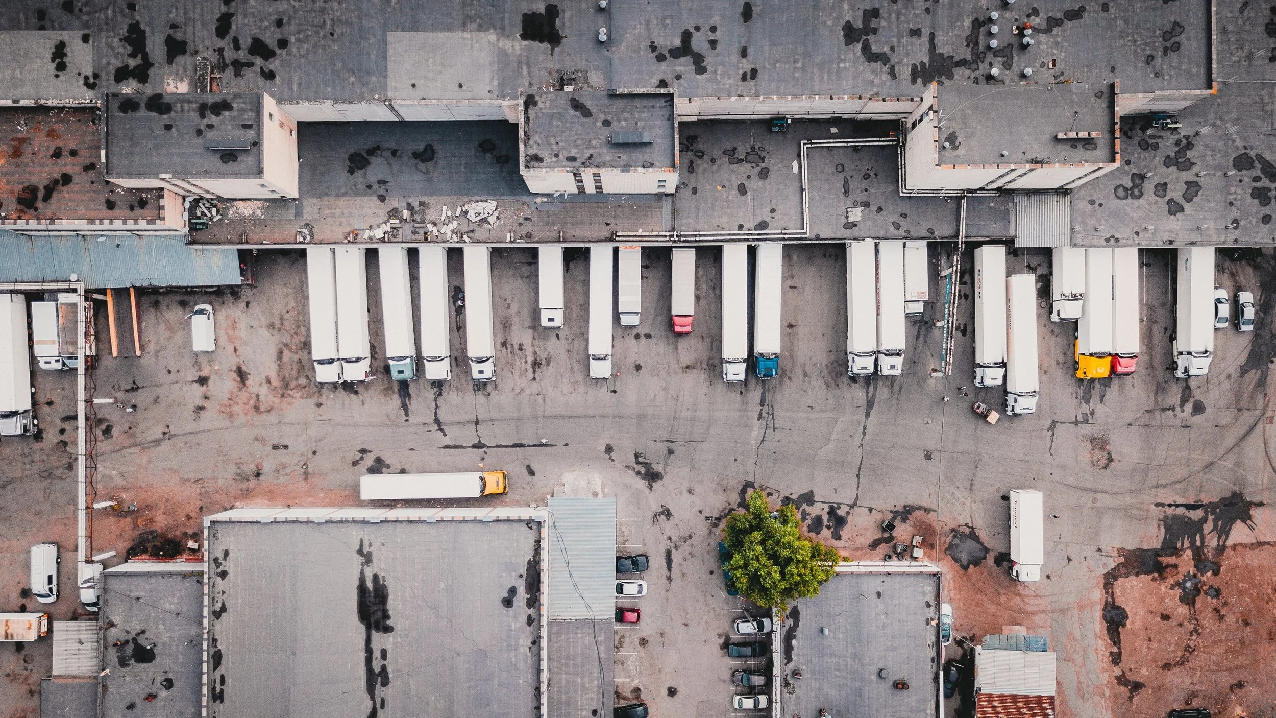 This is a photo I found online (free to use) by Ivan Bandura on Unsplash . I like how it shows the grittiness of supply chain/logistics and what happens behind the scenes so customers can enjoy their products.