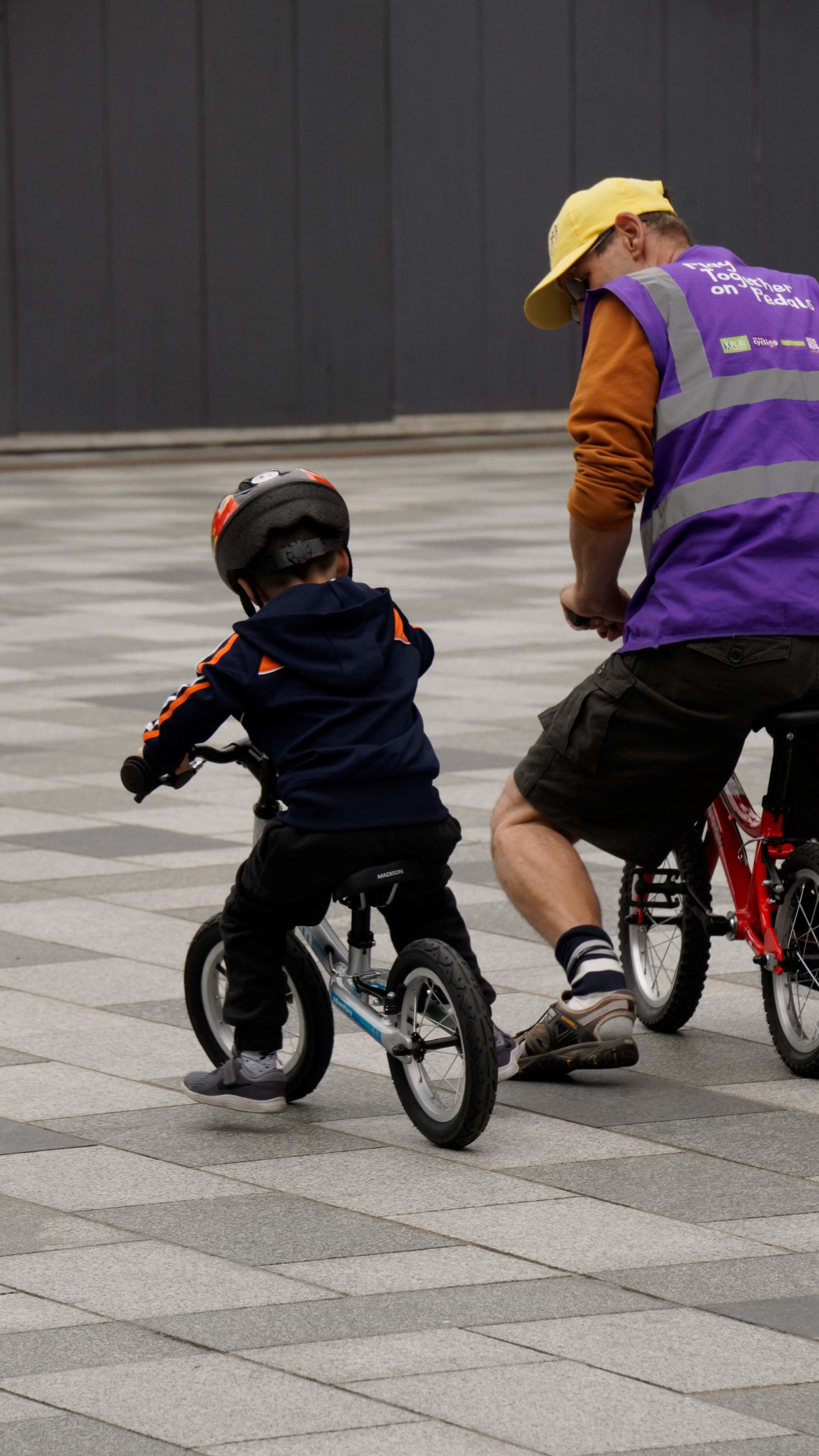 Emmet with one of the instructors from Play Together on Pedals.