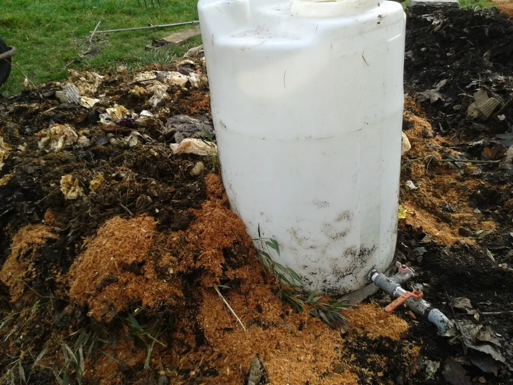 Building the compost around the water drum