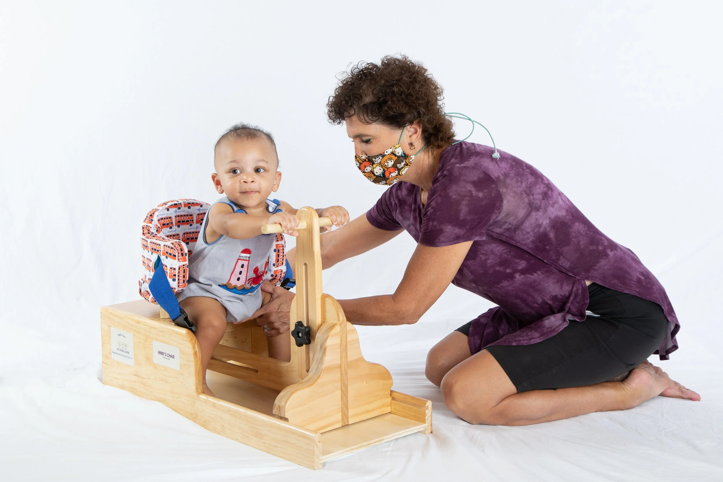 grayson reaching and holding both bars.JPG