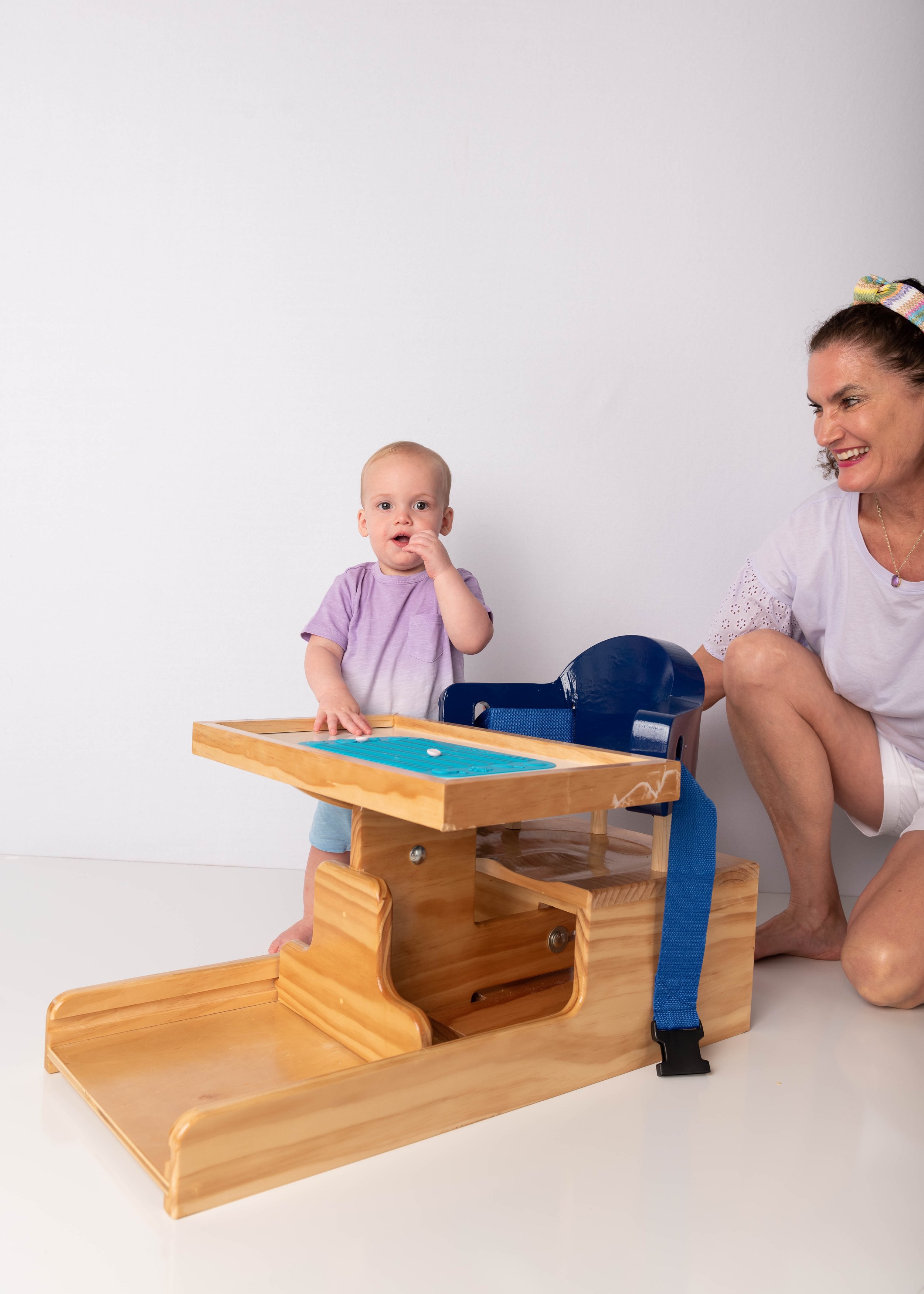 Auggie eating off silicone mat standing outside AAC.JPG