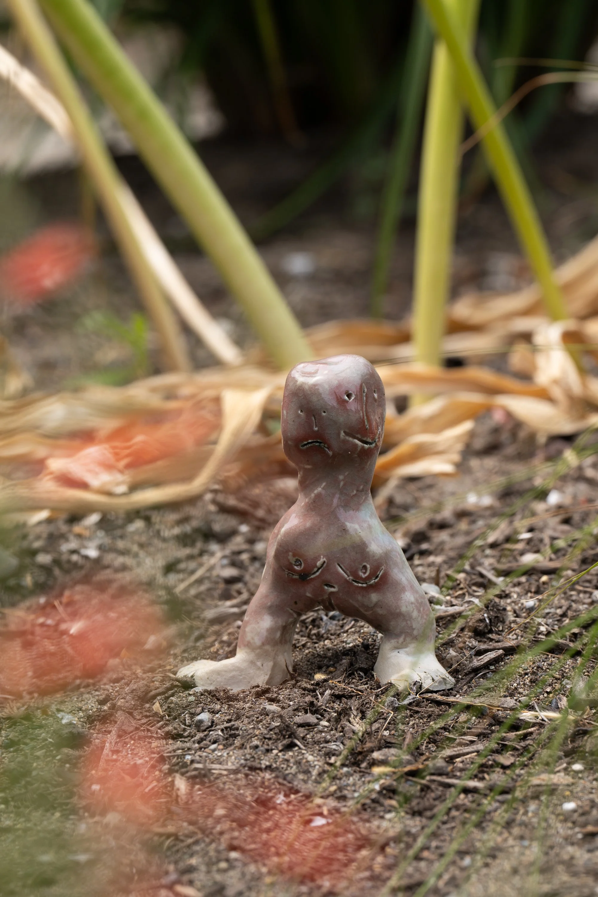 A ceramic figure on the ground.