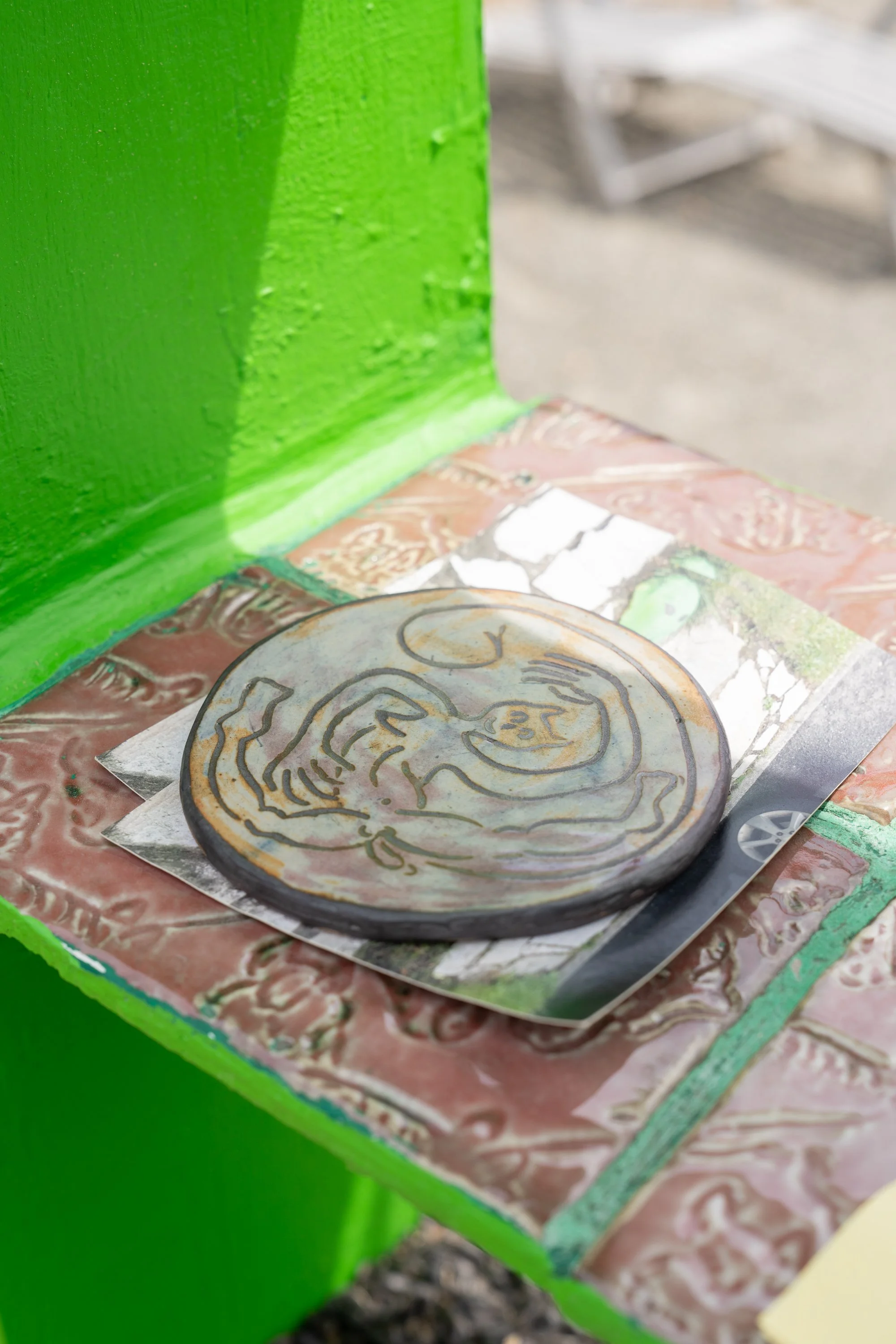 A ceramic tile on postcards.