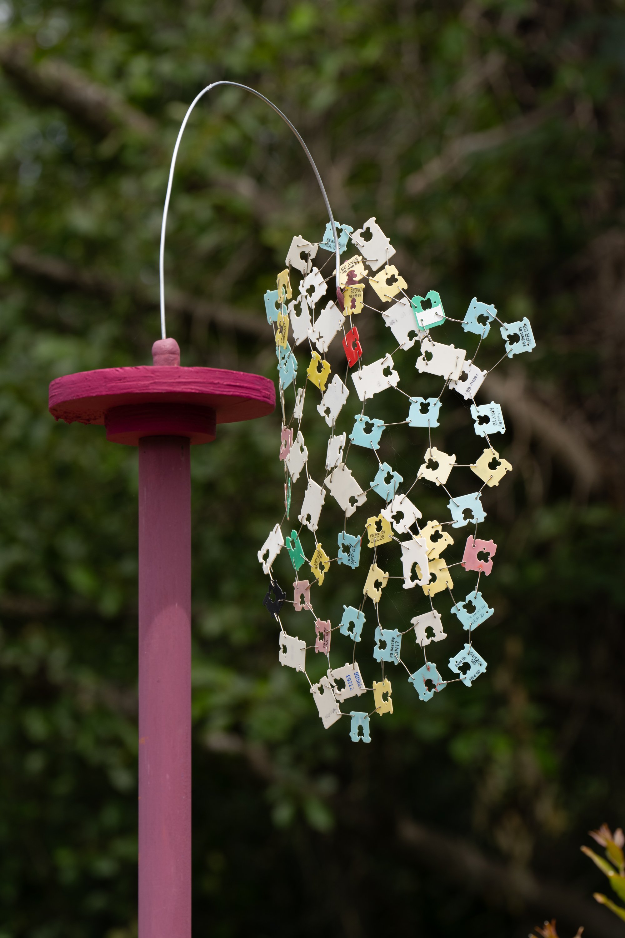 pink sculpture with bread ties