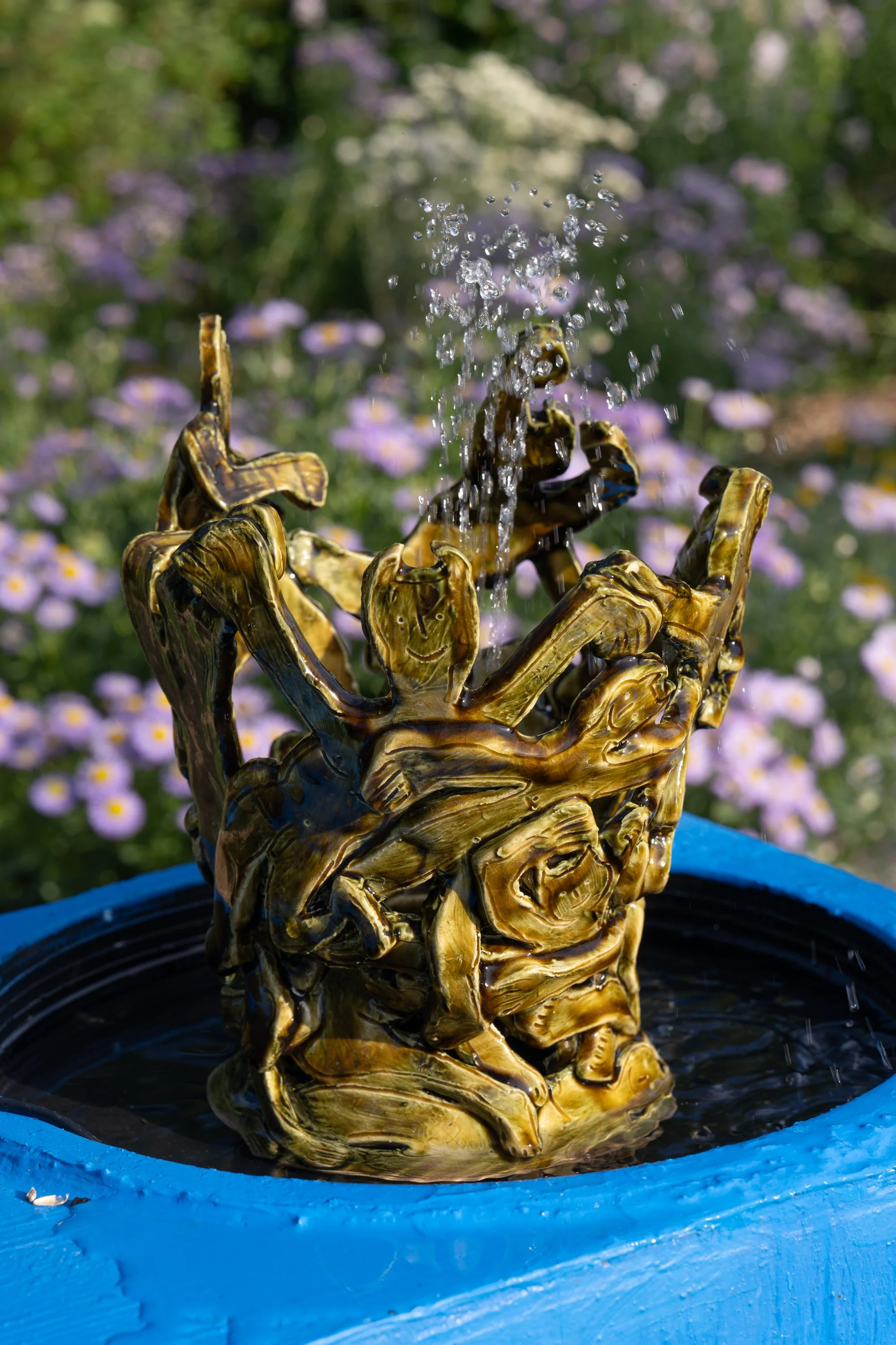 A water fountain in a ceramic sculpture.