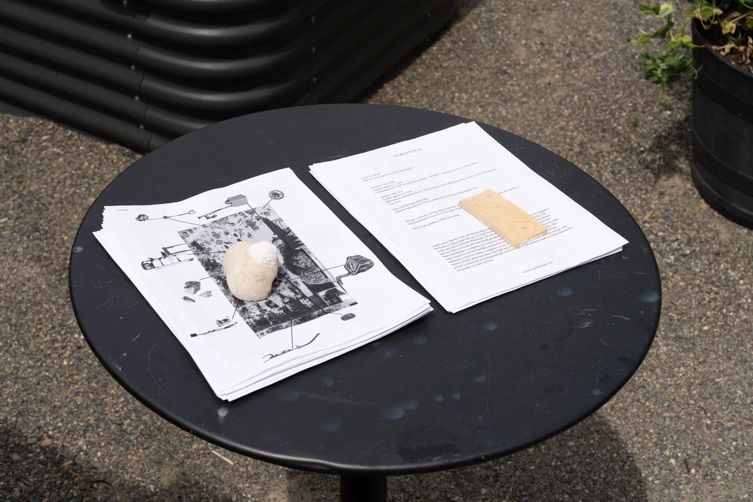 Maps and checklists on a black table.