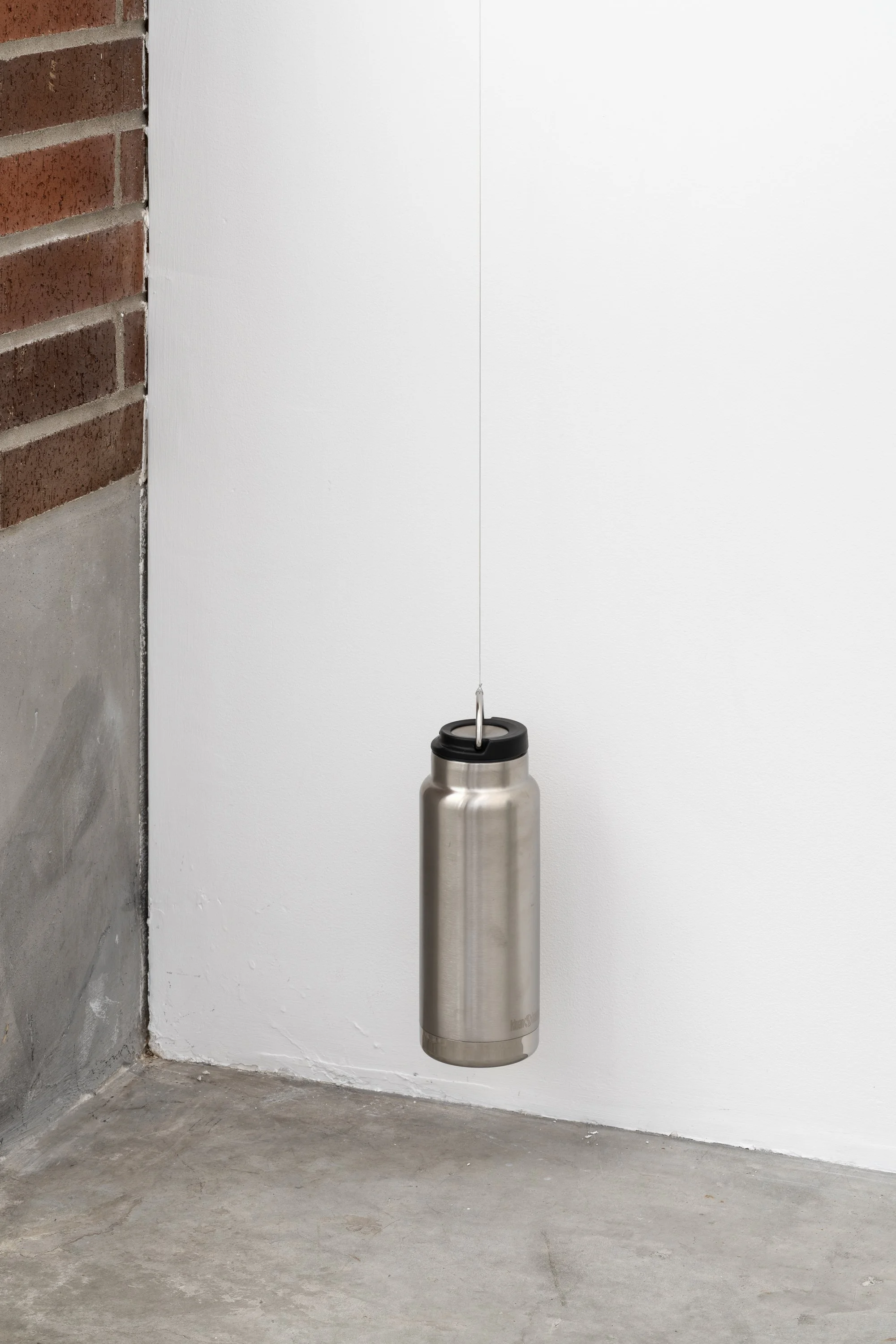 water bottle hung by a wire