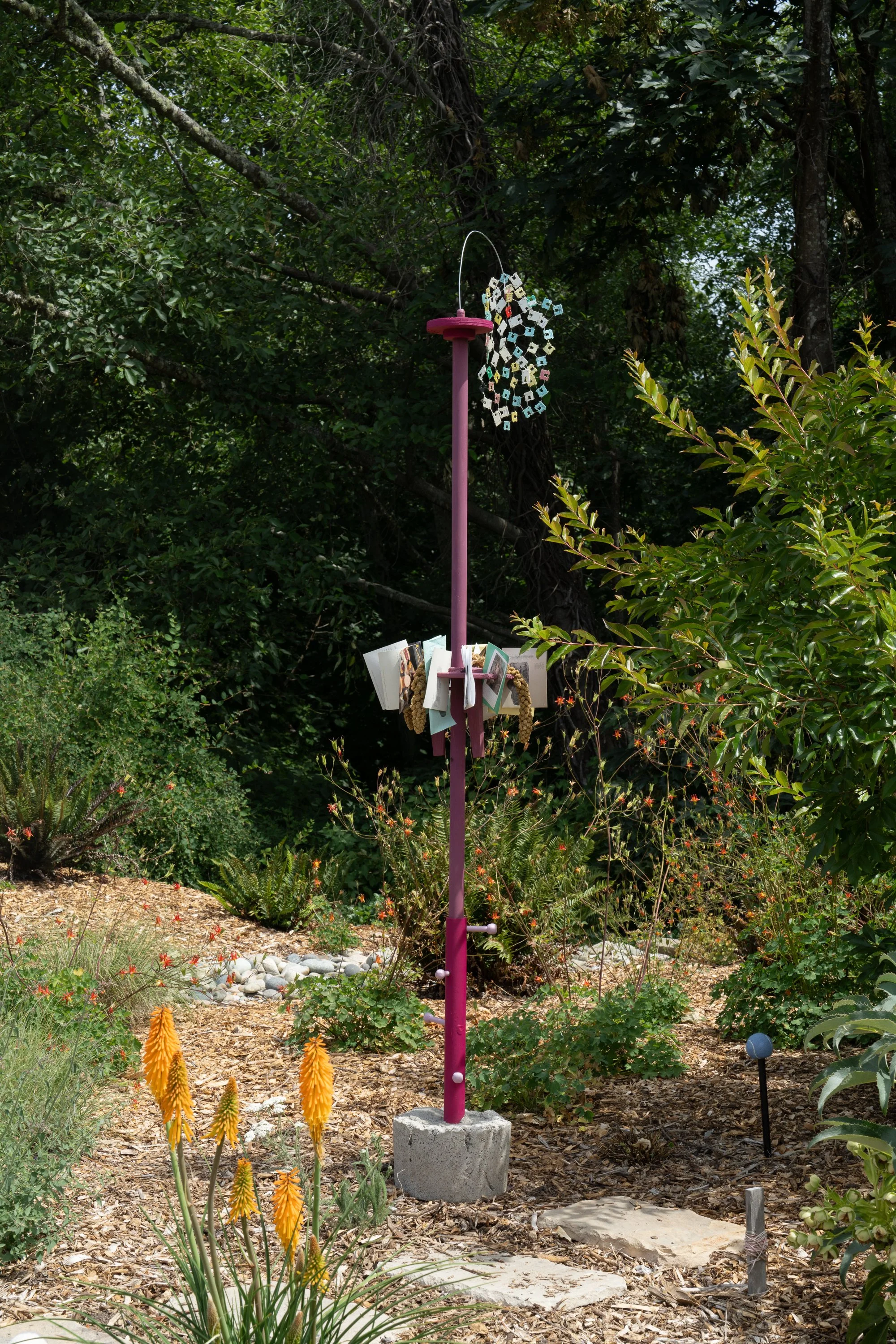 pink sculpture in a garden