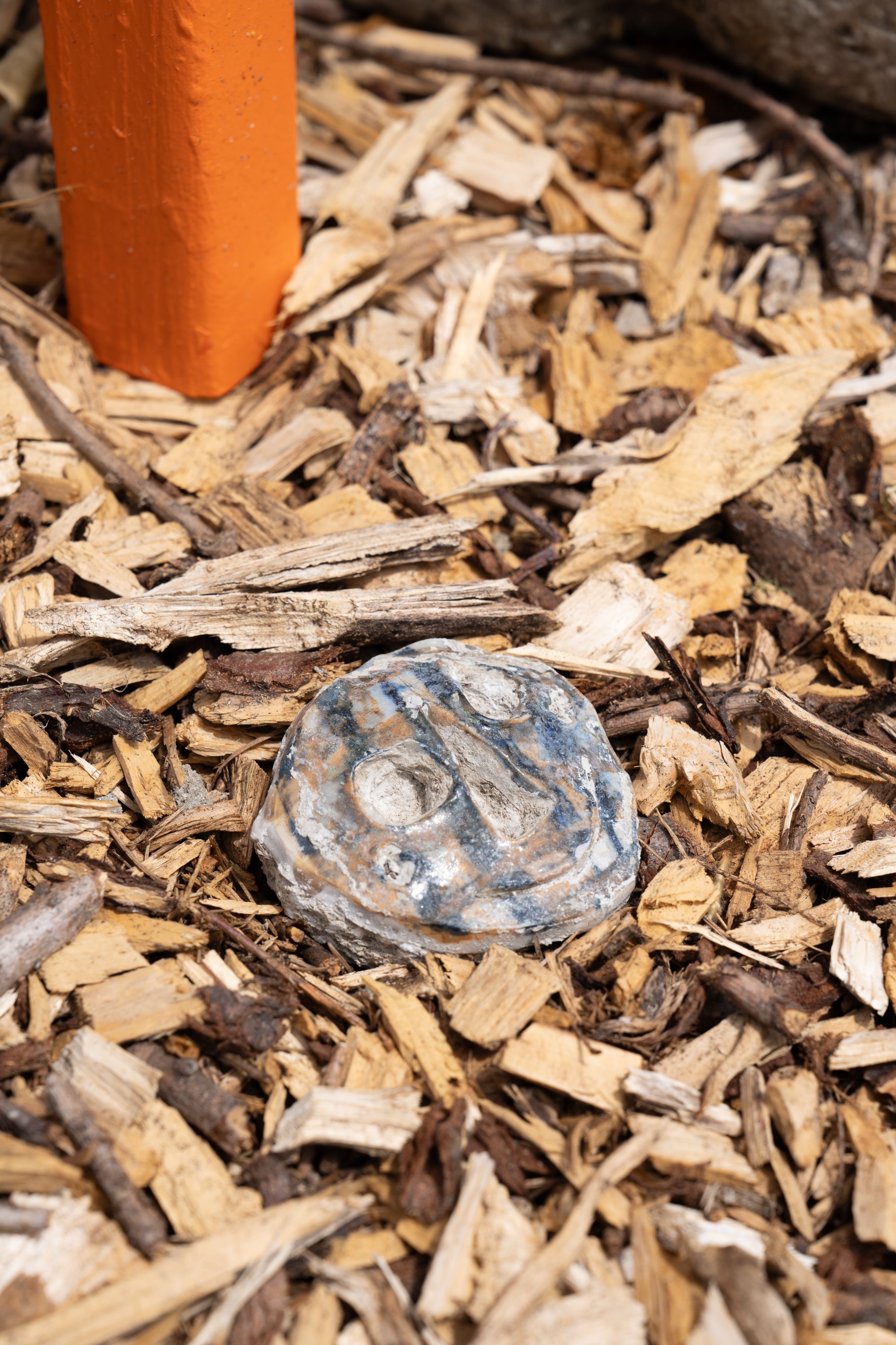 An abstract face in ceramics.