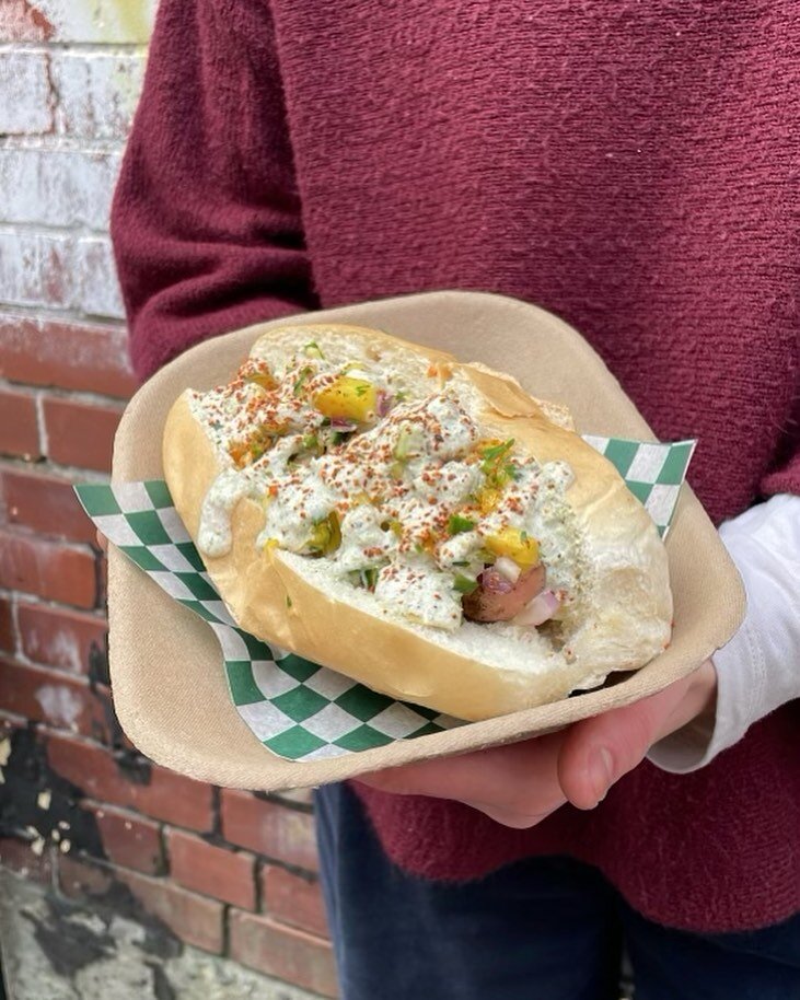 New dog for the final weekend! 🐶

Miami Weiss - Weisswurst with pineapple &amp; mango salsa, salsa verde aioli, and Tajin. 🥭🔥🍍

Catch us today and tomorrow from Noon to say see you next year! 

Oh, and #coyw ⚽️