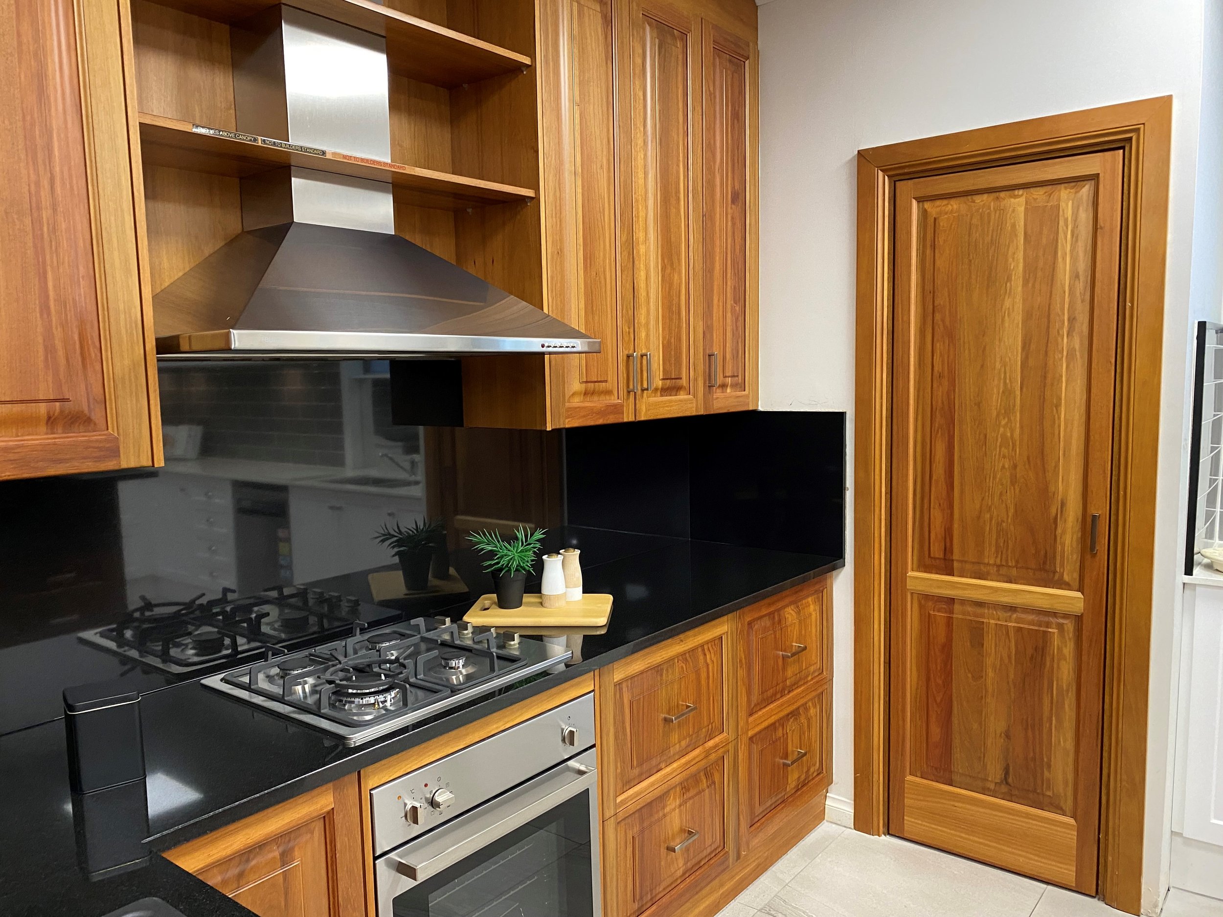 Absolute Black polished countertops &amp; splashback fabricated by Supreme Stoneworks