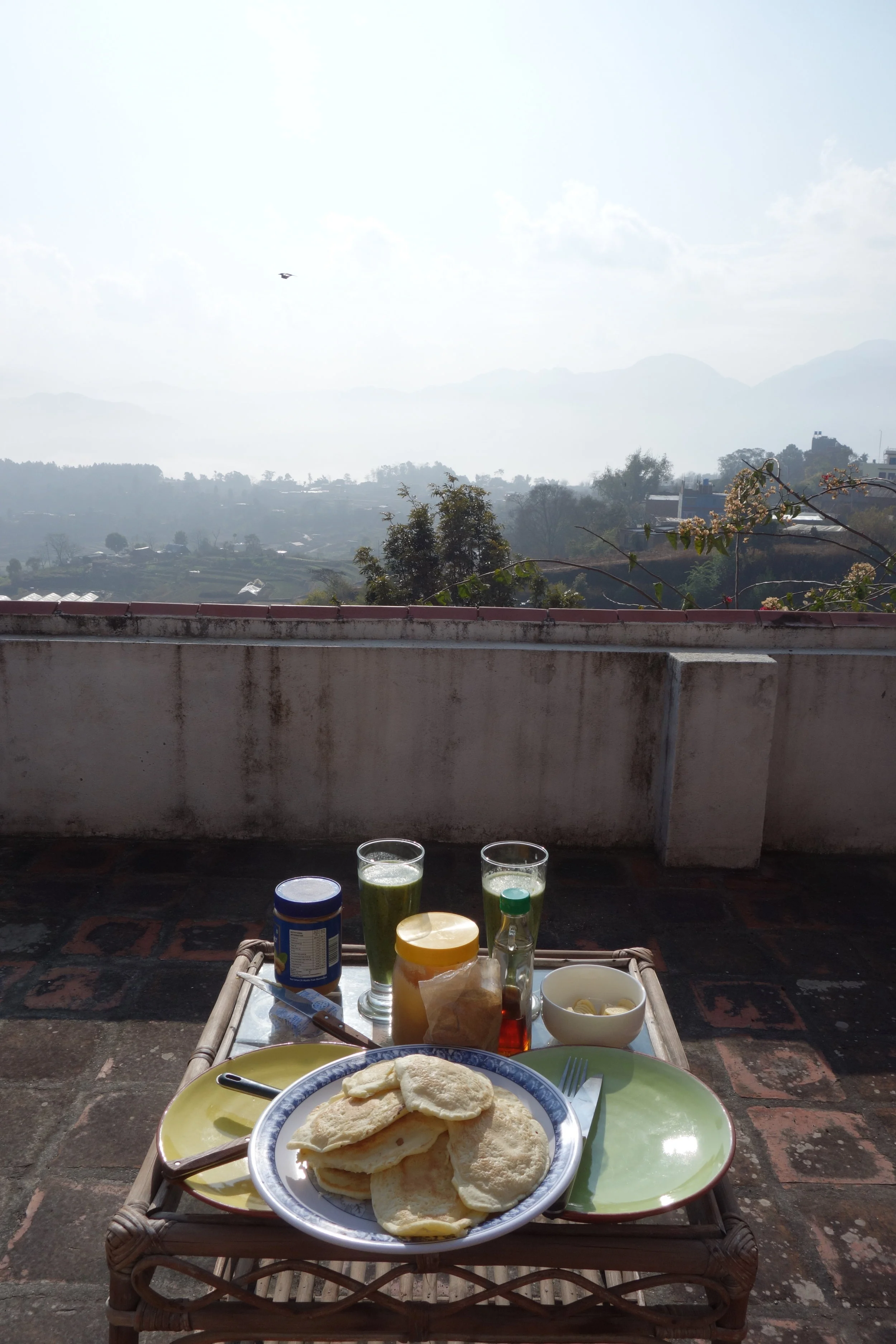 Sunny Sunday morning pancakes and green smoothie on the balcony of my apartment in Pharping