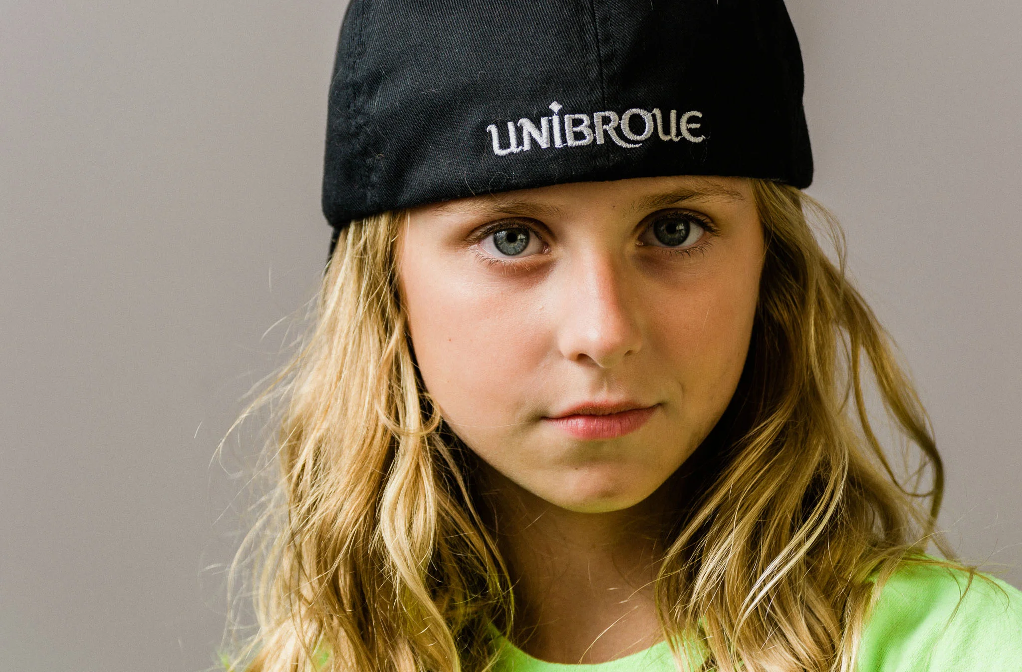 Grove City child portrait with hat on backwards