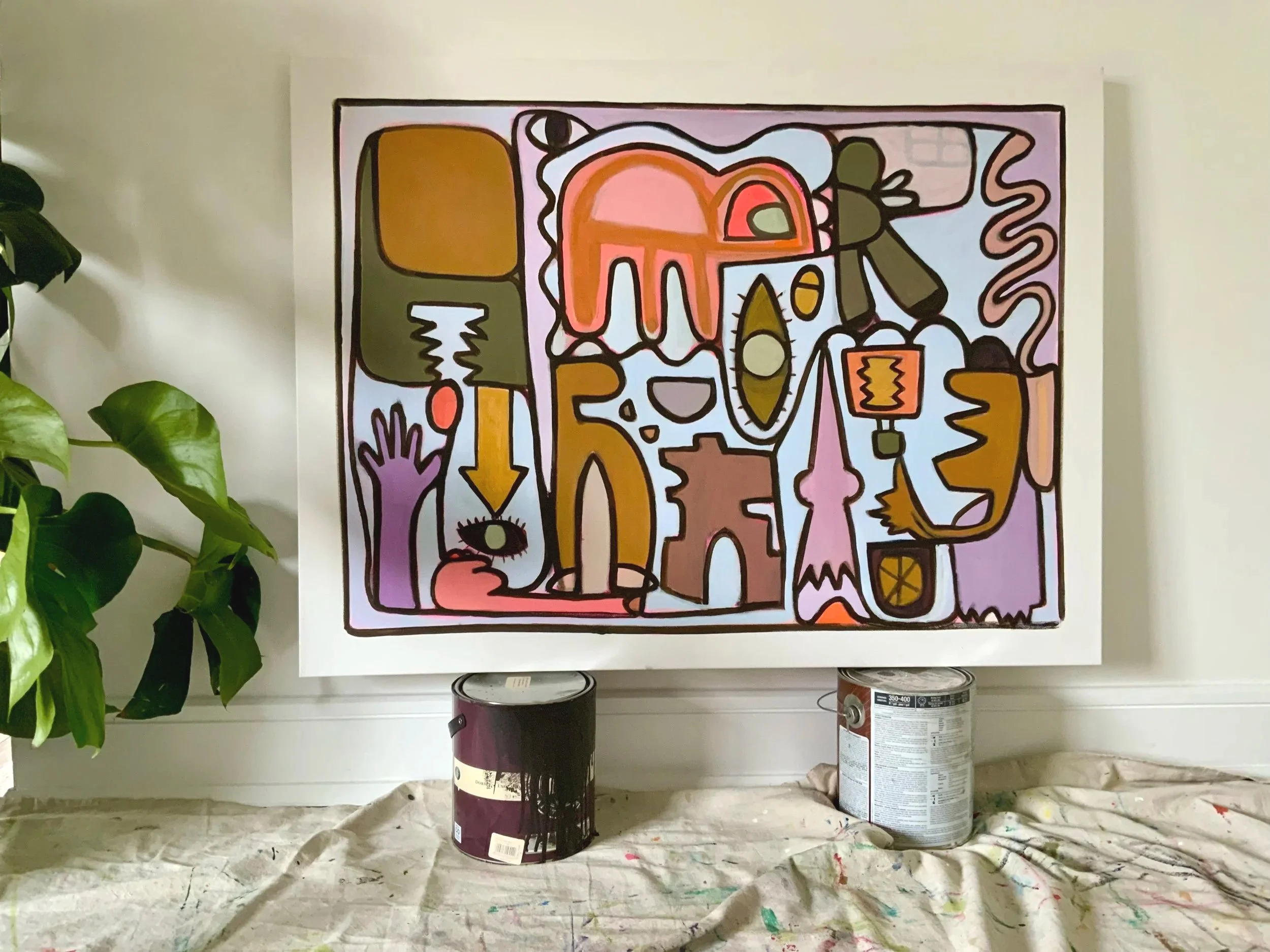 An abstract, colorful painting on a canvas with black outlines, featuring various shapes, eyes, and arrows. Denise Mortensen is a New Jersey abstract artist known for SHELFIES® — colorful, bright, and sentimental original abstract paintings inspired 