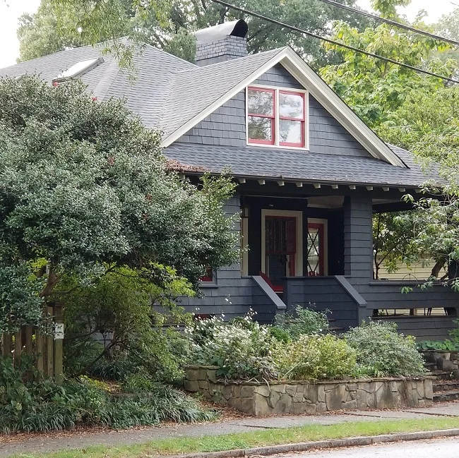 Though this home wasn’t on the tour, the pops of red trim caught my eye during the cloudy beginning to the day. The shake siding and simple architecture was punctuated by the happy accent.