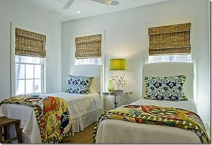 Modern bedroom with white wall and two single beds