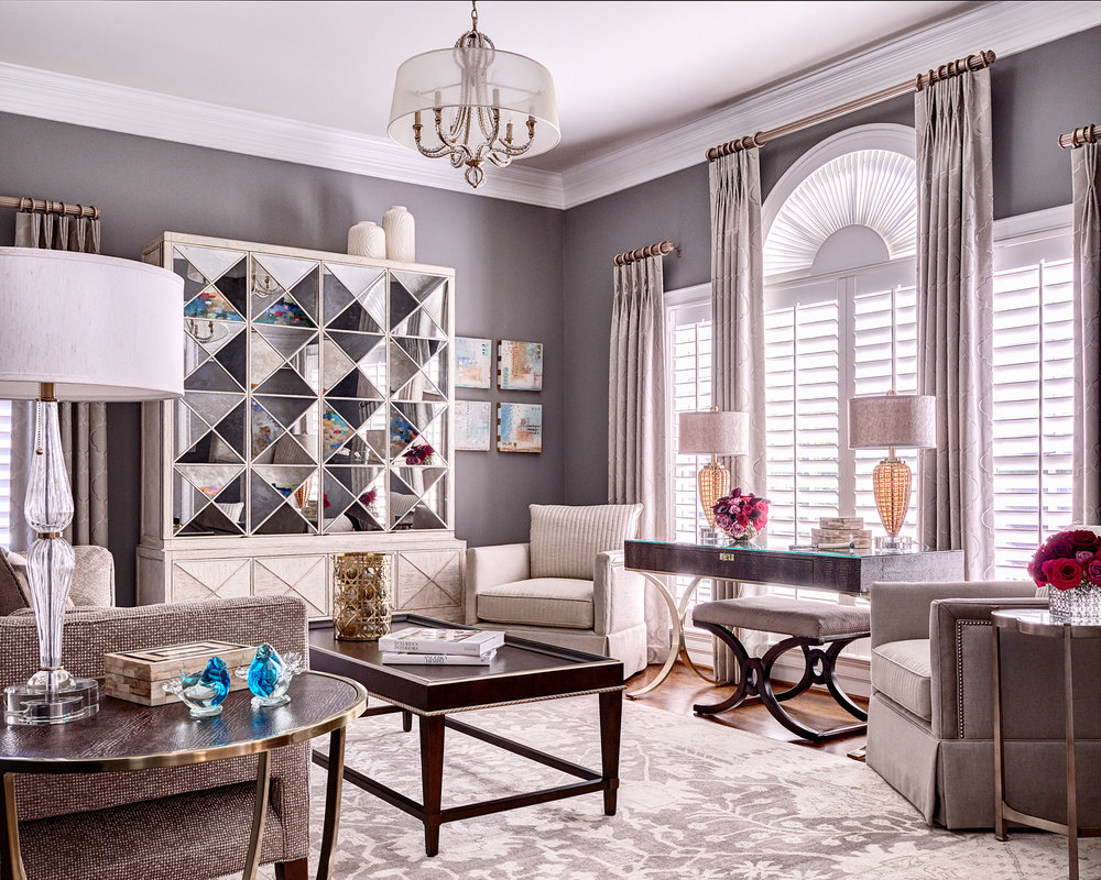 Modern living room with sofa, cabinet, table lamps and center table