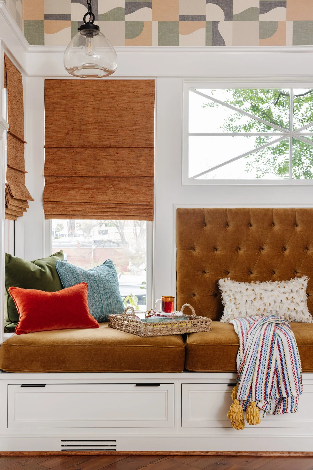 Banquette with tufted back and built-in drawers