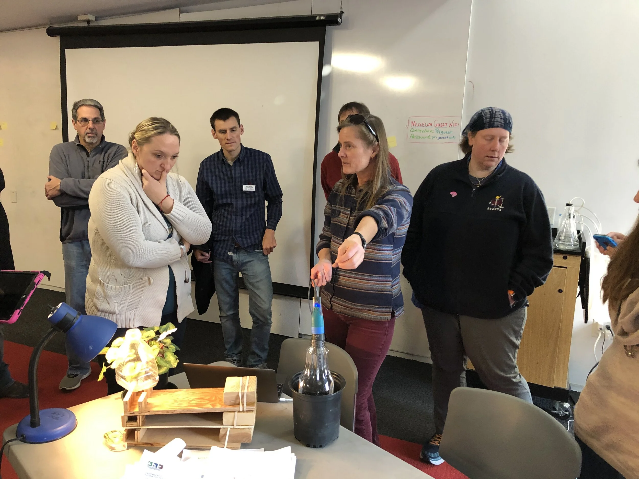 Alex with plant-CO2 set-up.jpg