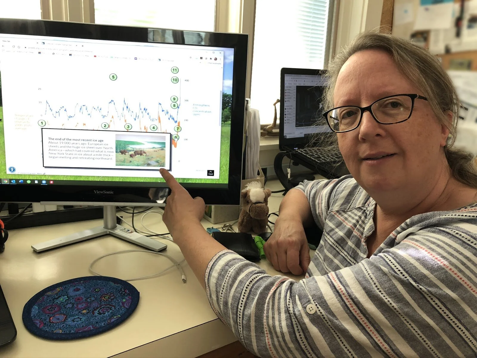 Dr. Ingrid Zabel, Climate Change Education Manager, working on the online exhibit.