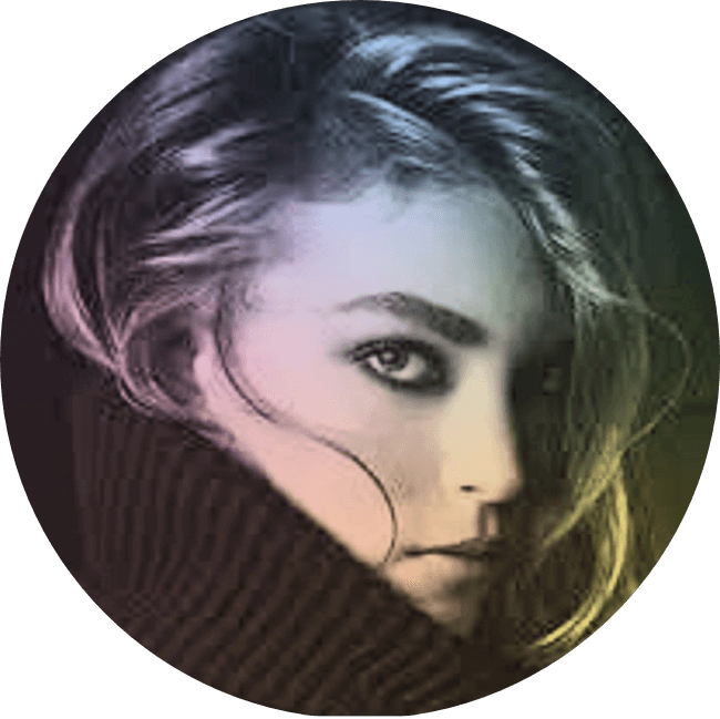 A close-up portrait of a woman with light-colored hair and intense gaze, partially covering her face with a dark sweater, with a gradient background.