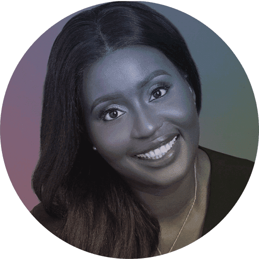 Close-up portrait of a smiling Black woman with straight hair, wearing a black top and a delicate necklace.