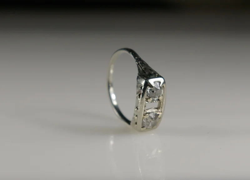 a-platinum-ring-missing-the-center-stone-before-restoration-the-side-view-at-crane-jewelers-ltd-in-seattle-wa.jpg