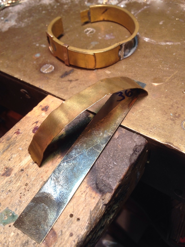 We rebuilt the buckle section in rose gold matched the long safety chain and repaired the clasp to make it functional.