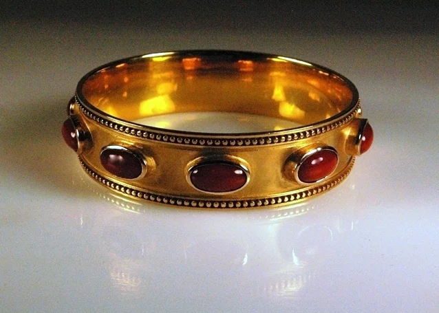 Finished Piece polished and set with Oxblood Coral