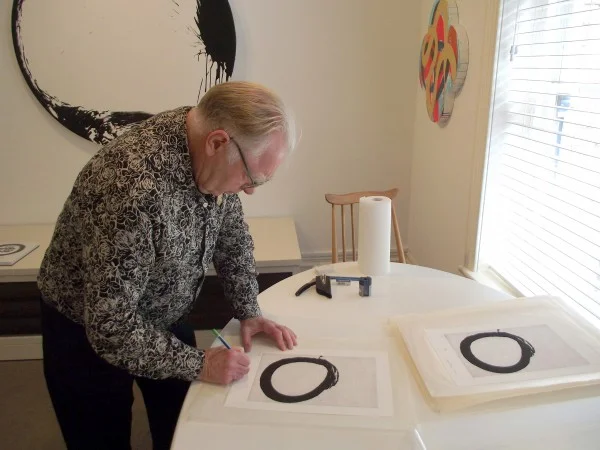 Max-Gimblett-signing-the-Enso-editon-18th-MArch-2015-600x450.jpg