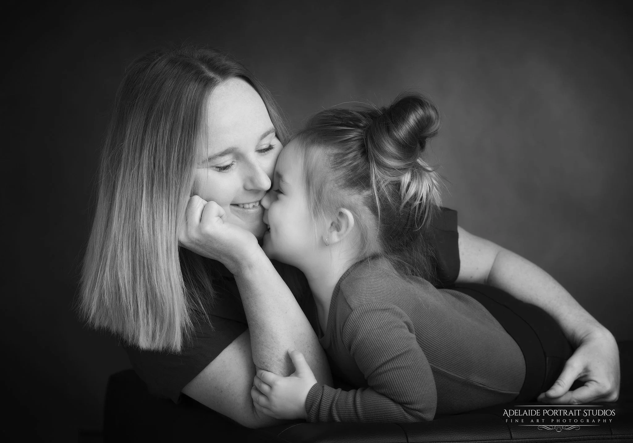 Cuddles Mother & Daughter gentle studio moment