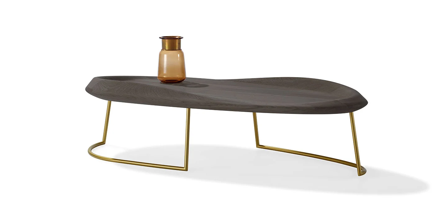 Produced by Draenert in collaboration with Babak Hakakian. This solid wood top table is inspired by the waves of the ocean but also the topography of land. As the wood rides up on once side you feel a sense of motion and depth as you round the way to the other side.