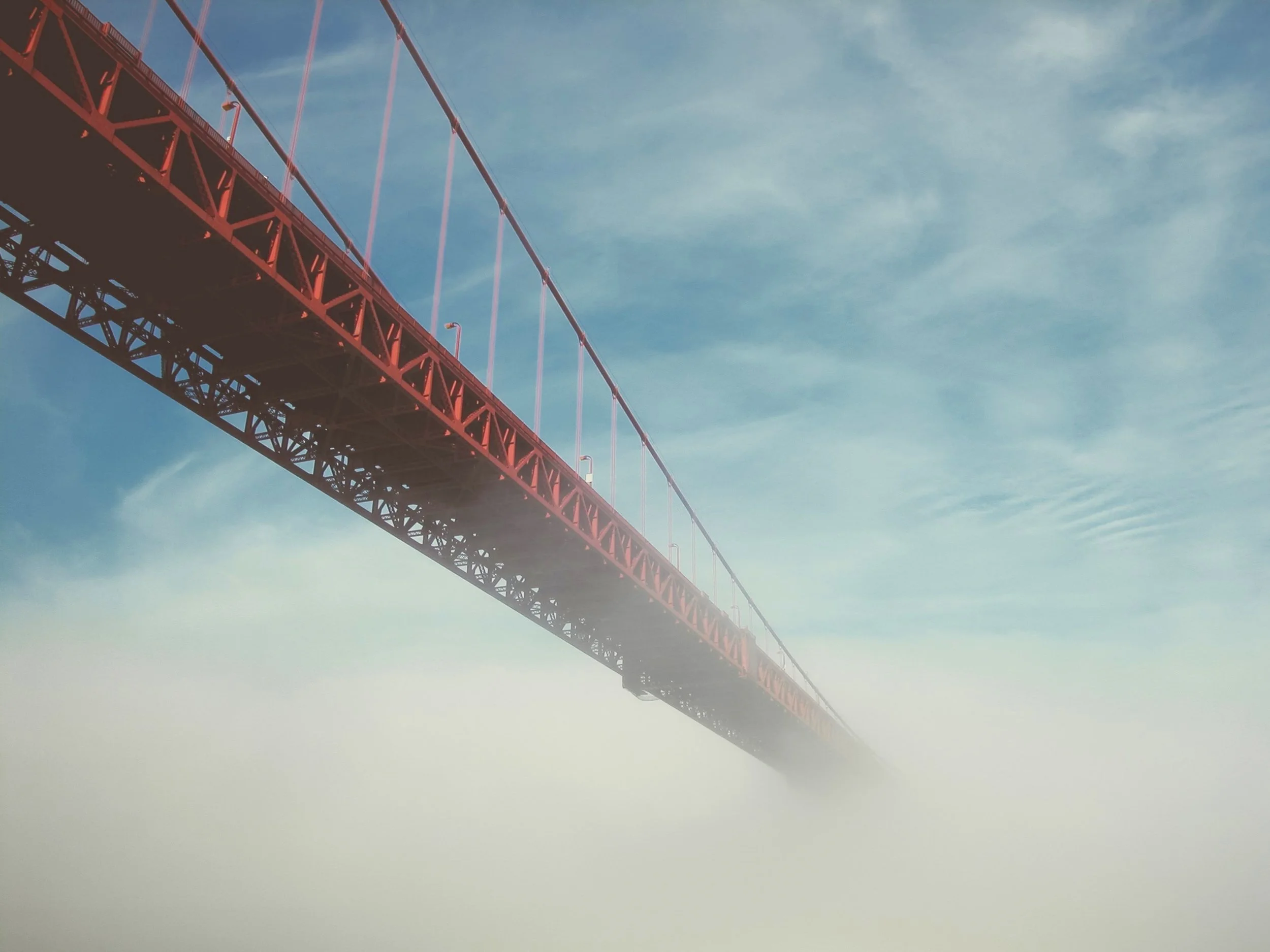 Imagine what may be at the end of this bridge. - Photo by Simon Stratford | Unsplash