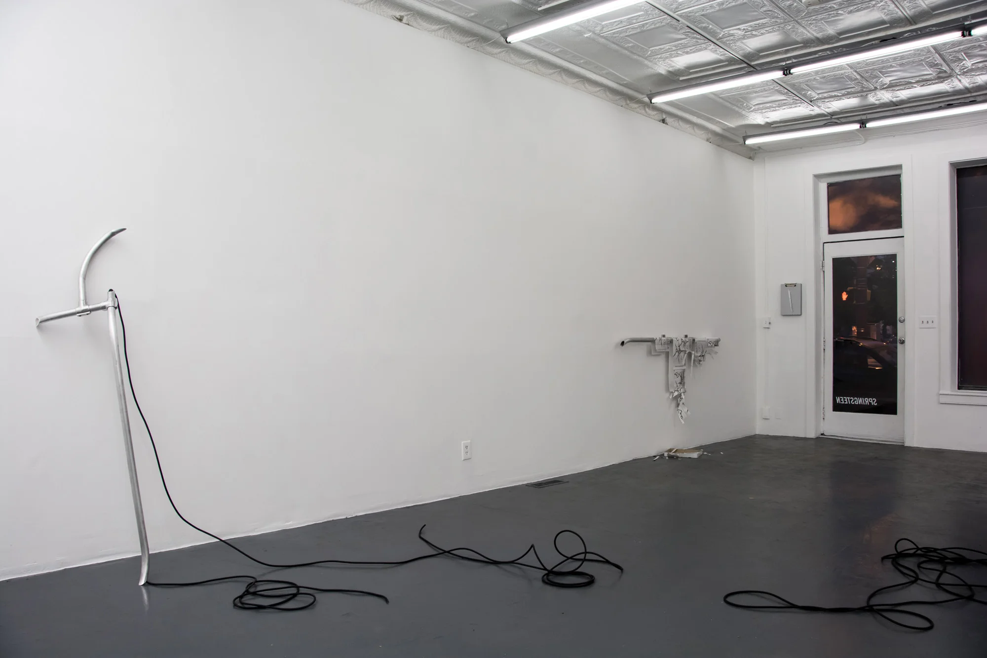 Laundered Fang (Gallery Main Room), 2016, Aluminum rail, hydraulic pressure, 6 AWG cable, T-8 Matrix(TM) guards