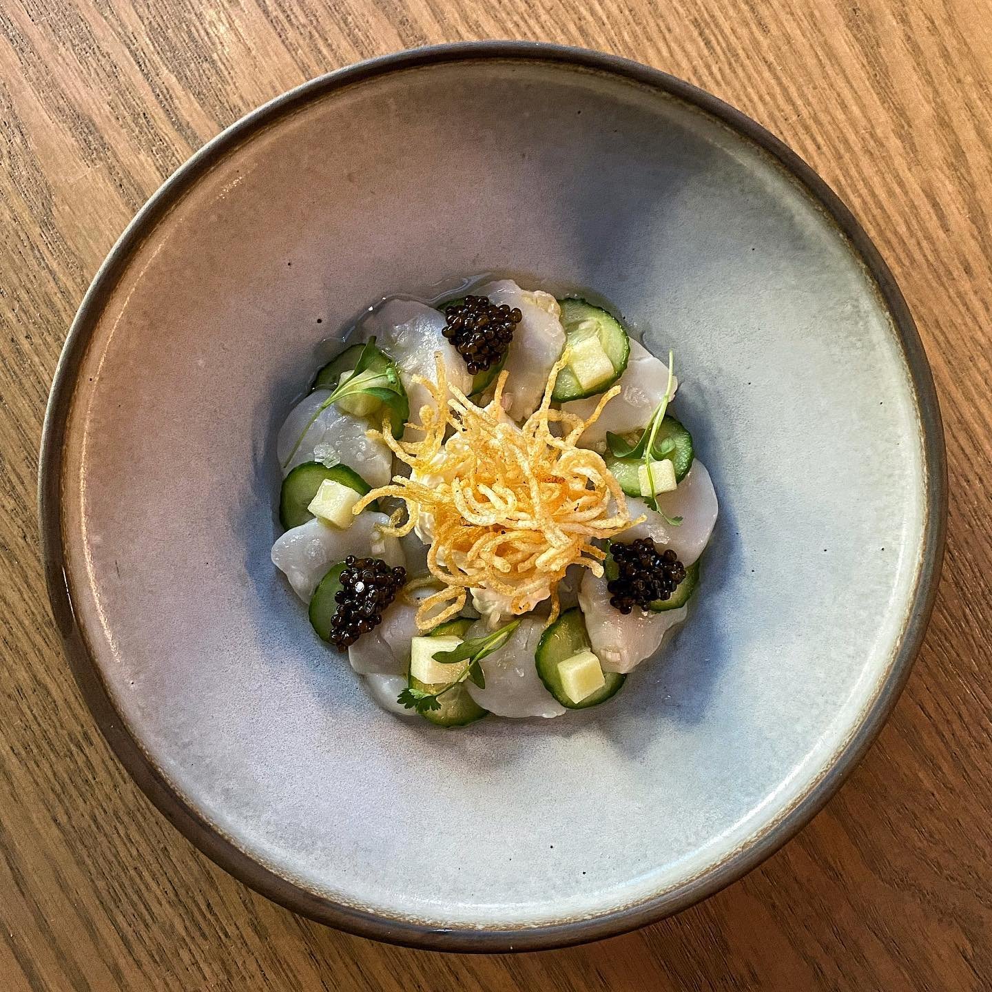 Atlantic Scallop Crudo, Kaluga Queen Caviar, Applewood Smoked Cr&egrave;me Fraiche, Baby Cucumber, Crispy Potato, Apple &amp; Shallot Vinaigrette, Pickled Green Apple

@patandbettys for @visaca