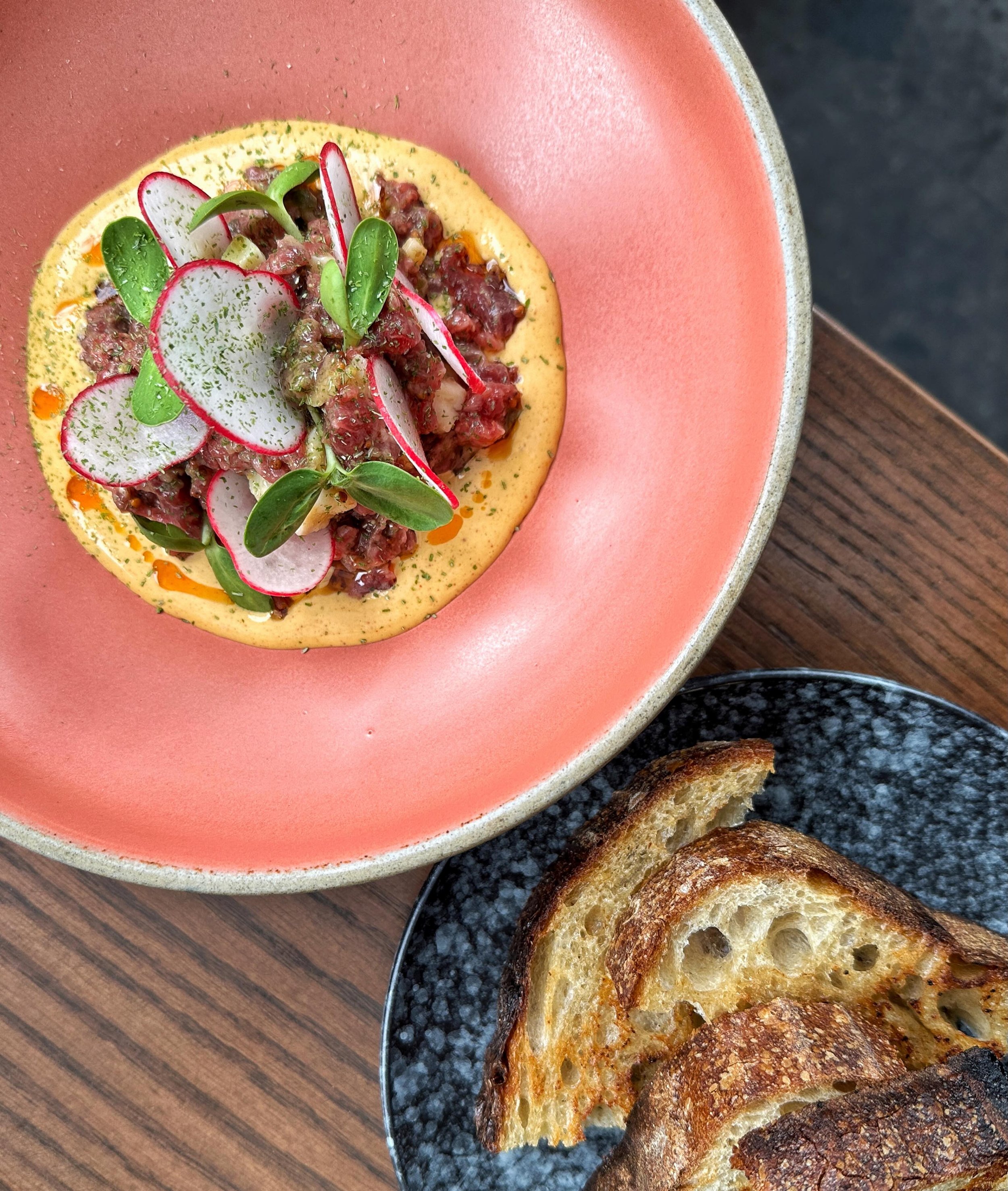 Angus Beef Coulette Tartare, Mustard Seeds, Aged Quebec Cheddar, Devilled Egg Aioli, Paprika Oil, Radish, Sunflower Sprout, Scallion Dust and Animal Butter Toasted Sourdough

🥩🌱🧀💯🫜✨🥚

@patandbettys