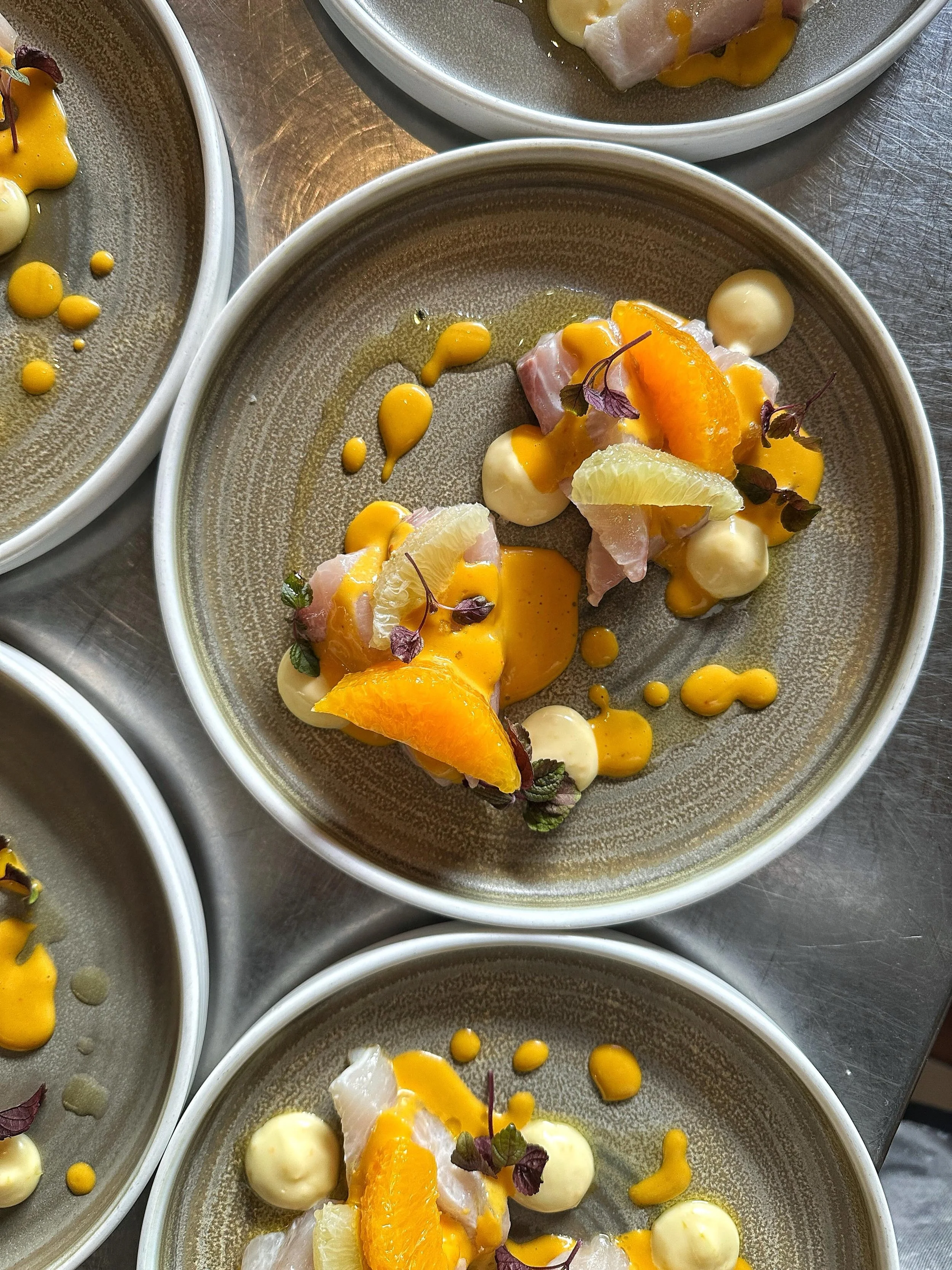 Hamachi, Tangerine &amp; Chili Vinaigrette, Orange Blossom Aioli, Lime &amp; Orange Segments, Olive Oil, Shiso

✨🐟🍊🍽️🌶️⛓️&zwj;💥🍋&zwj;🟩

Fanny Bay Oysters, Pineapple Sorbetto, Pisco &amp; Honeydew Melon Pearls

🧊🍈🥄💚🦪🍍🔐

First 2 Courses f