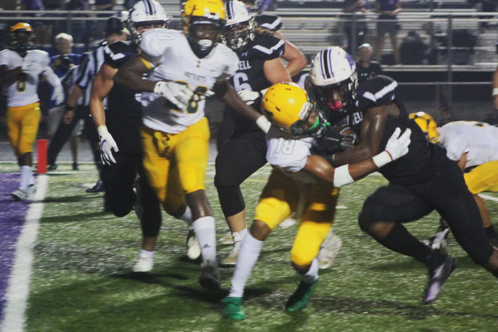 AK’s Kaci Seegars runs thru a Patriot defender for the TD. (Brandon Black)