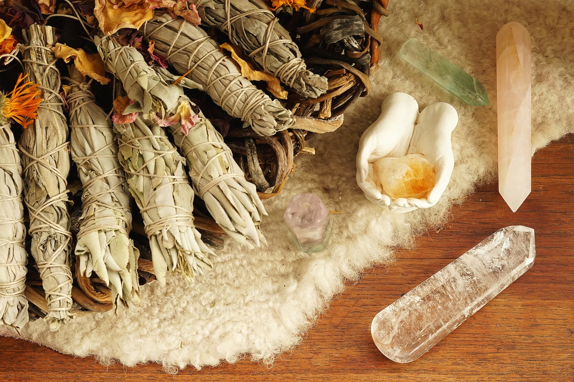 crystals_sage_hands_flowers.jpg