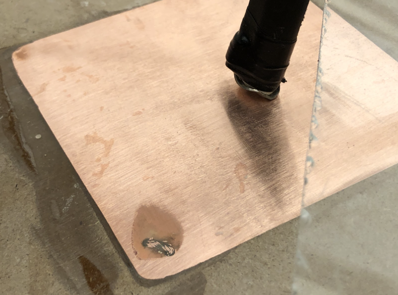 The charging system was integrated into the base by embedding copper squares into the landing pad and soldering on the charging wires. The copper pads were sized by measuring the position of the drone’s feet after centering and adding a one inch saf
