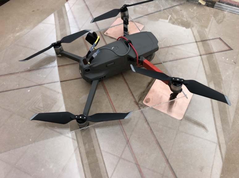 Centering mechanism was designed to return the drone to its charging pads.
