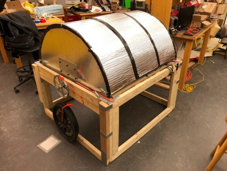 Closed drum. Drone is housed inside to protect from weather.