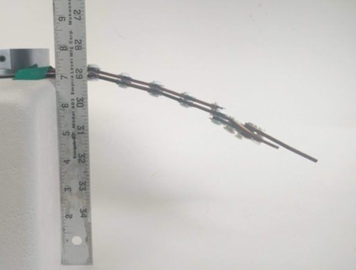 This design was discarded because of excessive deflection under its own weight caused by flexibility at the joints.