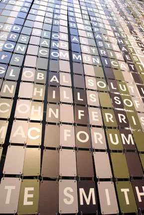 30-foot sponsor wall of printed metal dog tags