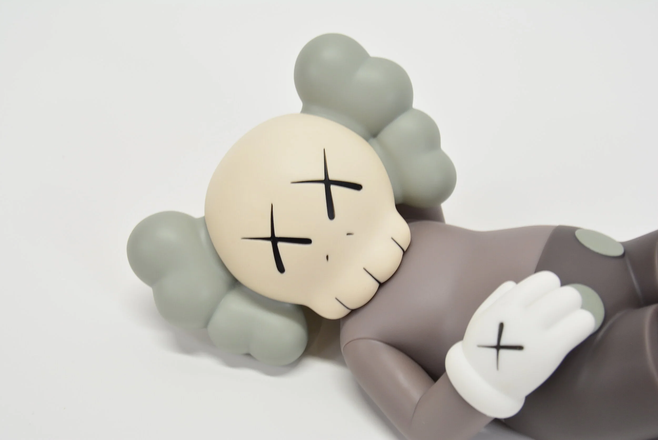 KAWS HOLIDAY JAPAN VINYL FIGURE (BROWN) — STANDARD X FUTURE