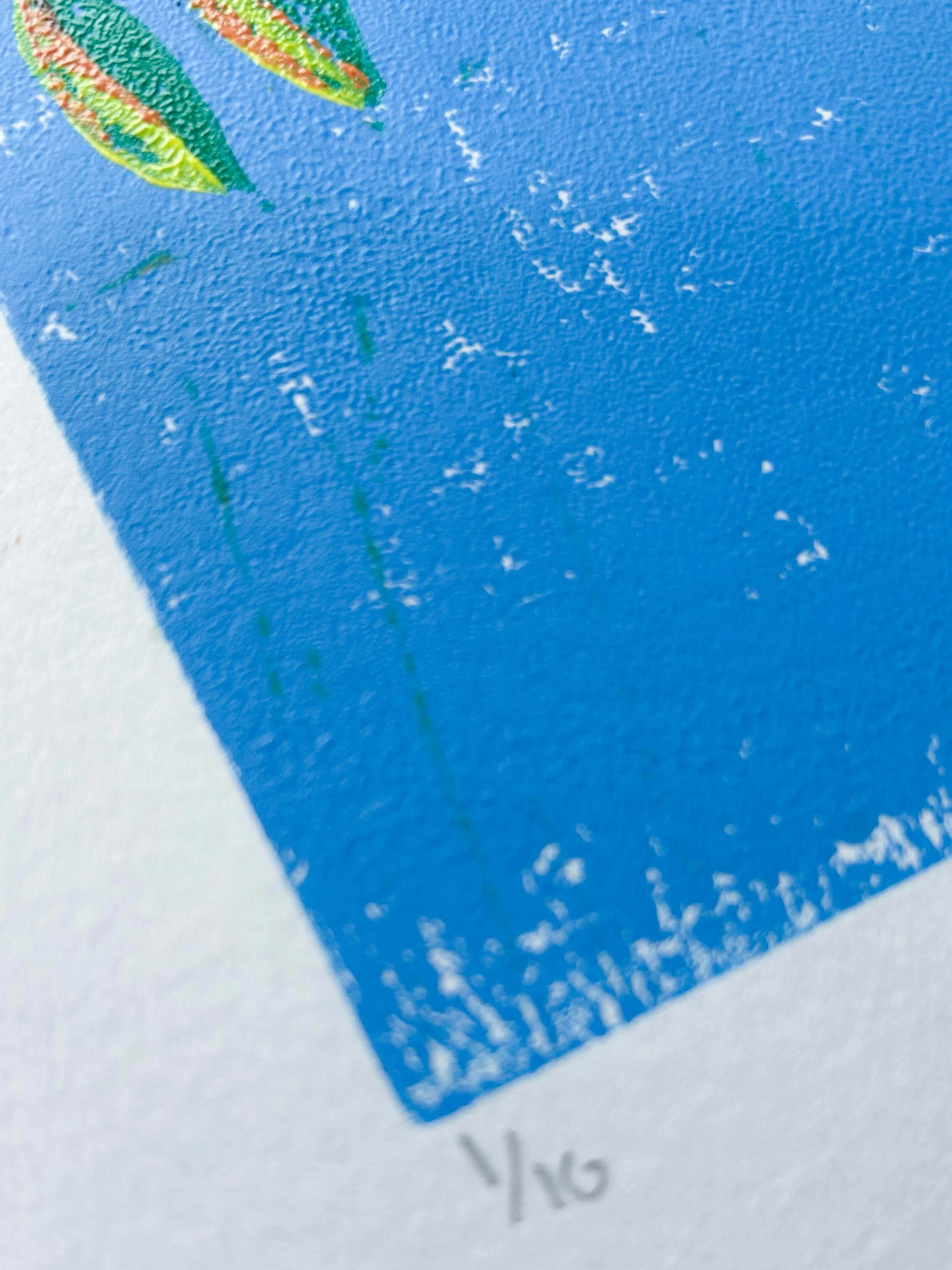 Numbered detail of Limited edition linocut of the end of autumn when just a few leaves are left on the cherry tree - copper trunk against an ombre blue sky with leaves in green, yellow, orange and red