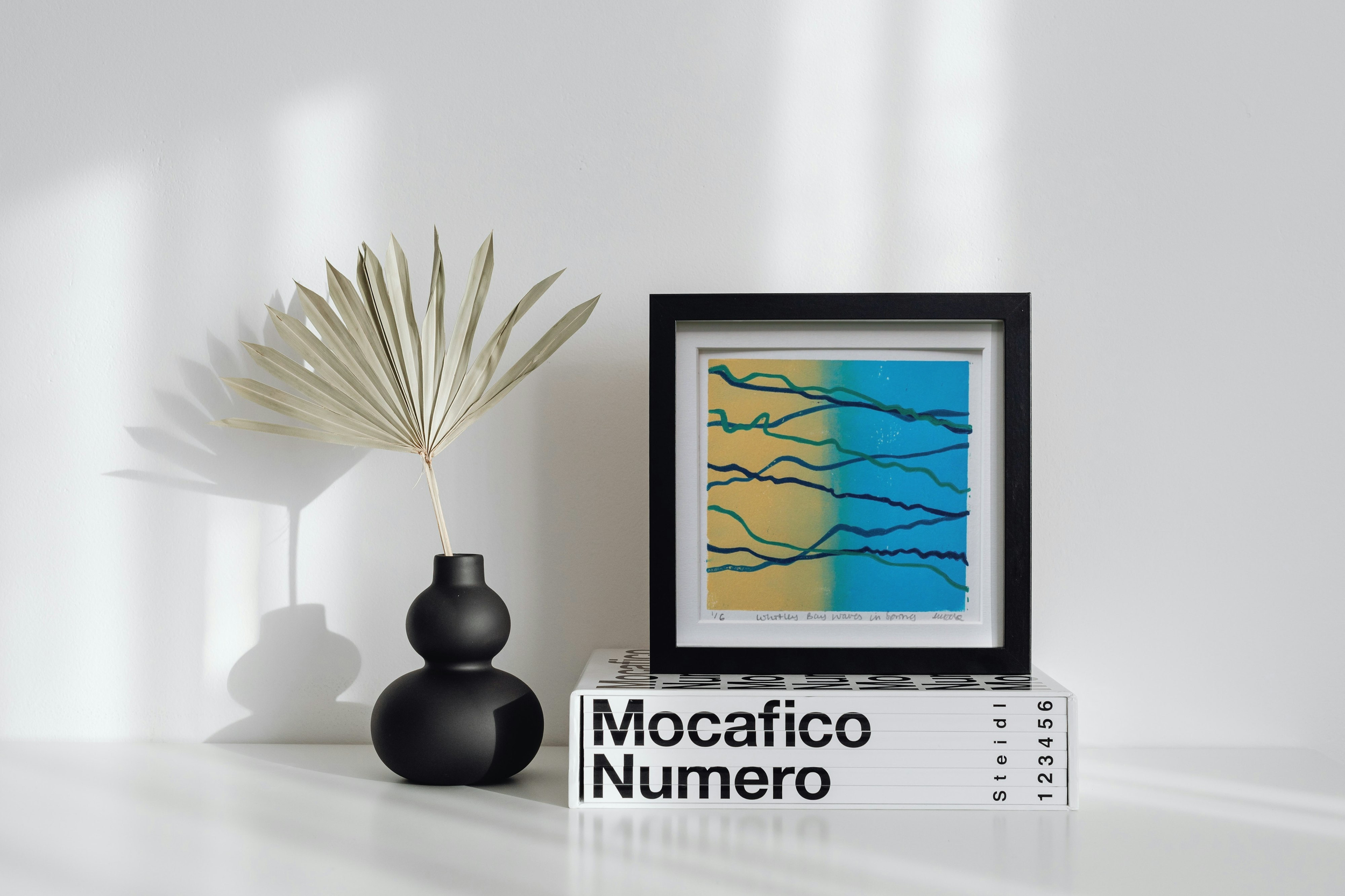 Hand Printed Whitley Bay Waves in Spring, Abstract Linocut in warm blue and ochre blend with navy teal and emerald lines